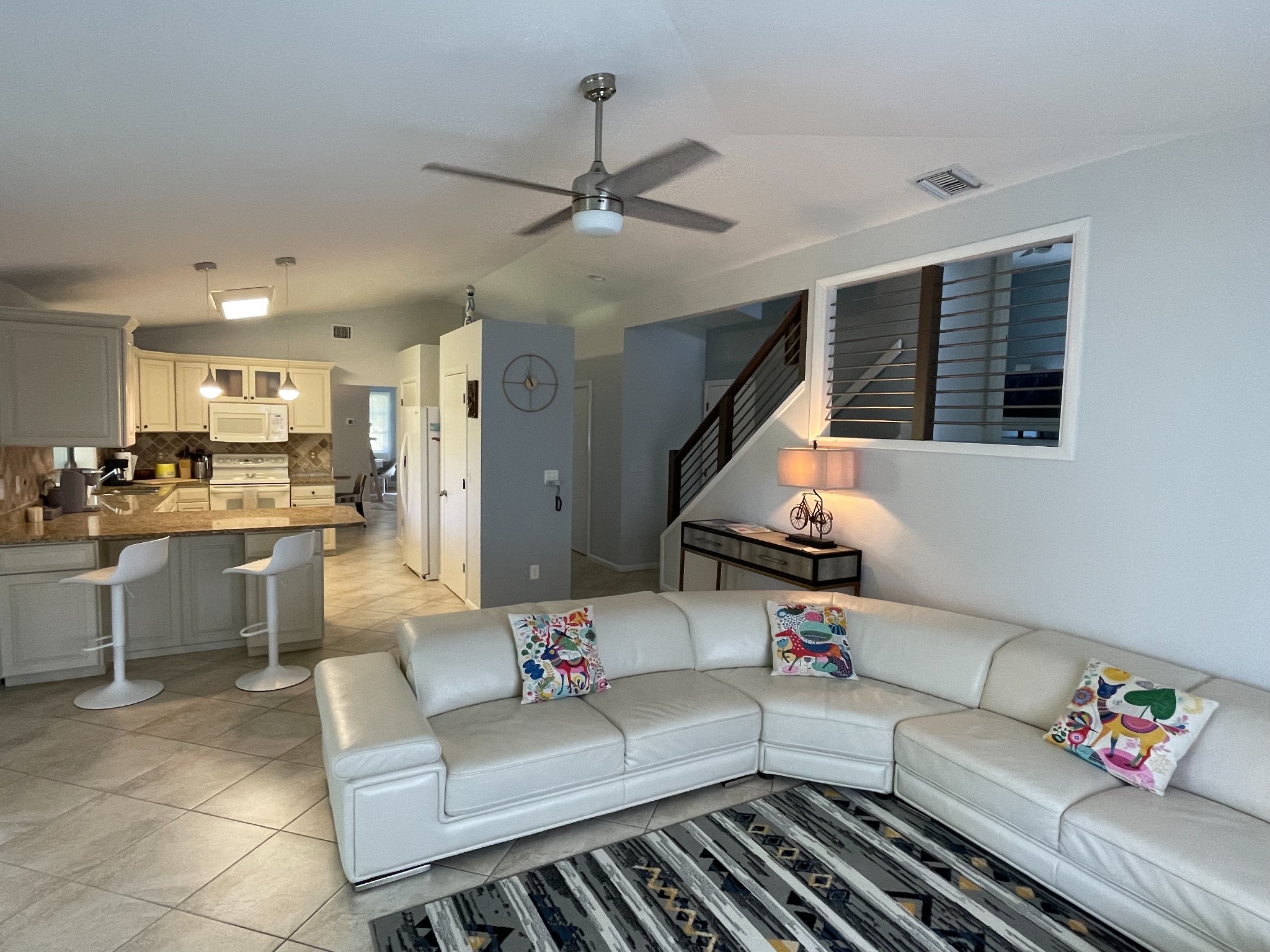 Bright open living room and kitchen in the Marco Island vacation home